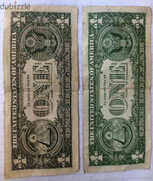 دولارين امريكي يرجع لعام 1957 واخر لعام 1981 1