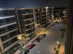 In Taj City Compound - New Cairo, a 115-meter apartment for sale with a roof, with a 10% down payment and installments over 8 years