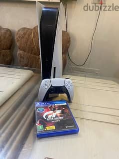 playstation 5 with one hand and a CD gift