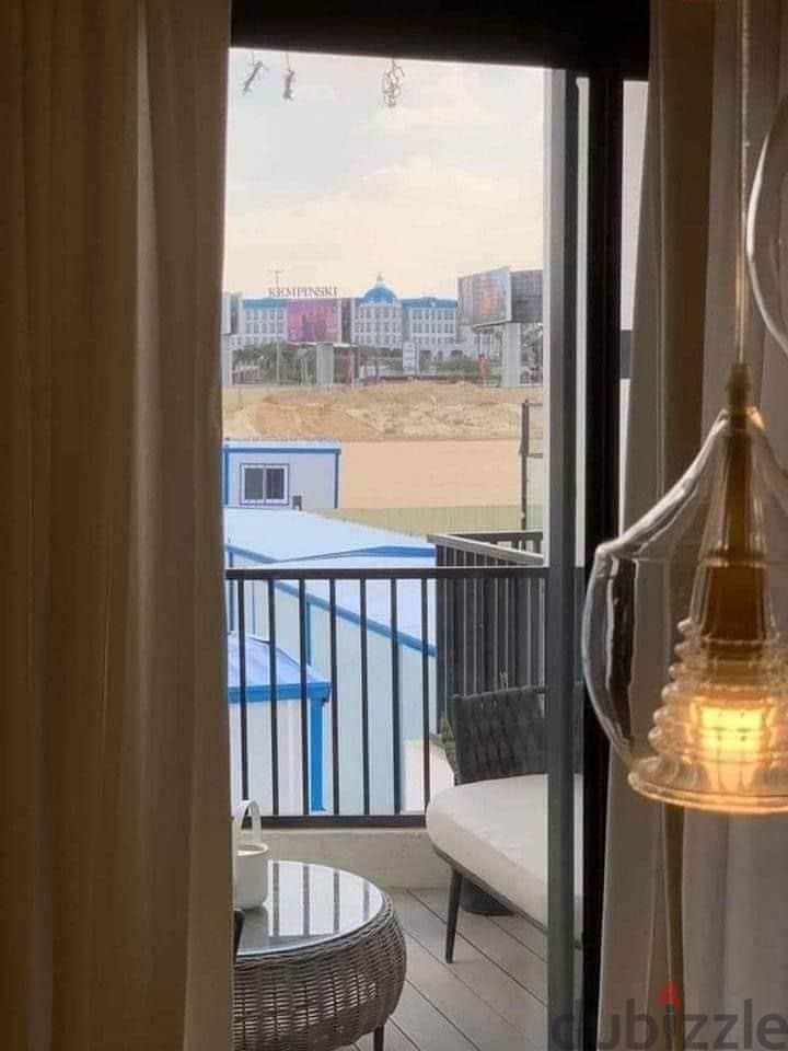 With a 42% discount, a distinctive apartment for sale in the heart of the settlement, Taj City, on the Suez Road, directly in front of Cairo Airport, 12