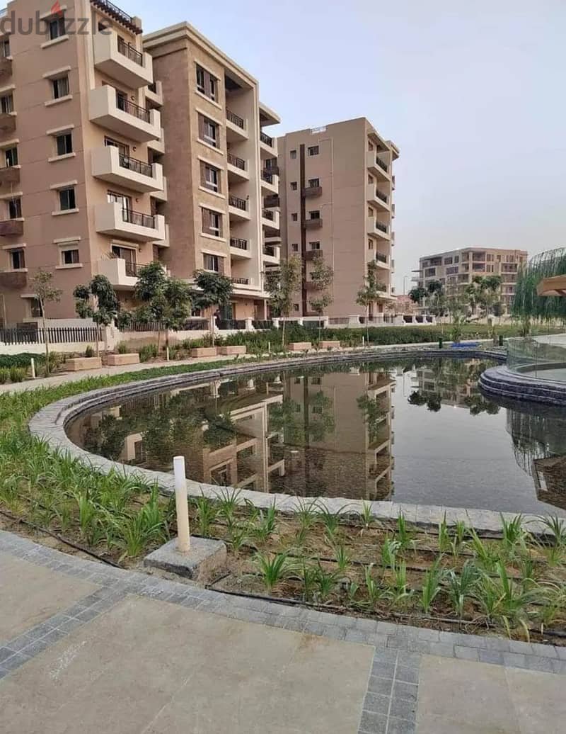 apartment directly in front of the airport with a 10% down payment in Taj City Compound, Fifth Settlement 4
