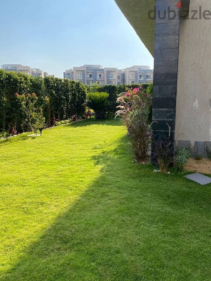 Fully finished ground floor apartment with garden in Galleria Compound near the American University Immediate receipt Swimming pool view 1