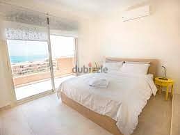 with down payment 400k own typical floor chalet sea view in telal ain sokhna area 130 meters - fully finished with installments over 7 years 2