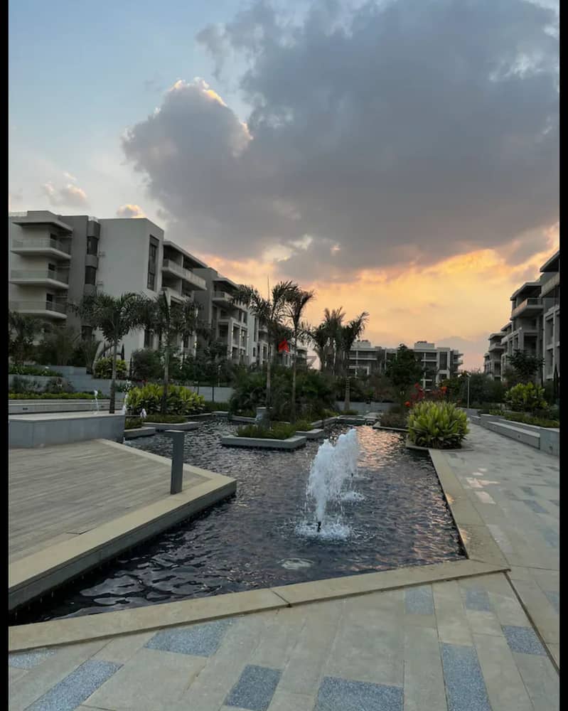 Apartment 165. M with garden 110. M in The Address East New Cairo fully finished with kitchen cabinets overlooking landscape and water features for sale 0