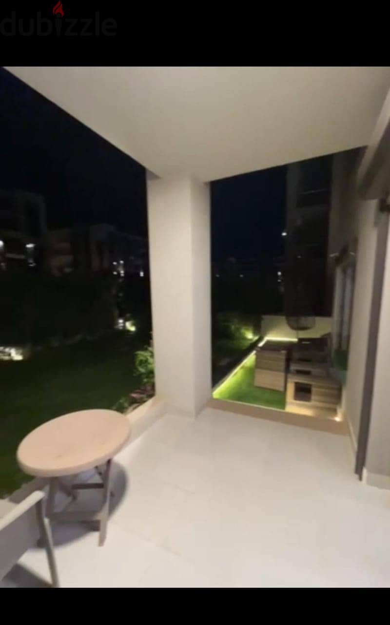 Apartment 165. M with garden 110. M in The Address East New Cairo fully finished with kitchen cabinets overlooking landscape and water features for sale 2