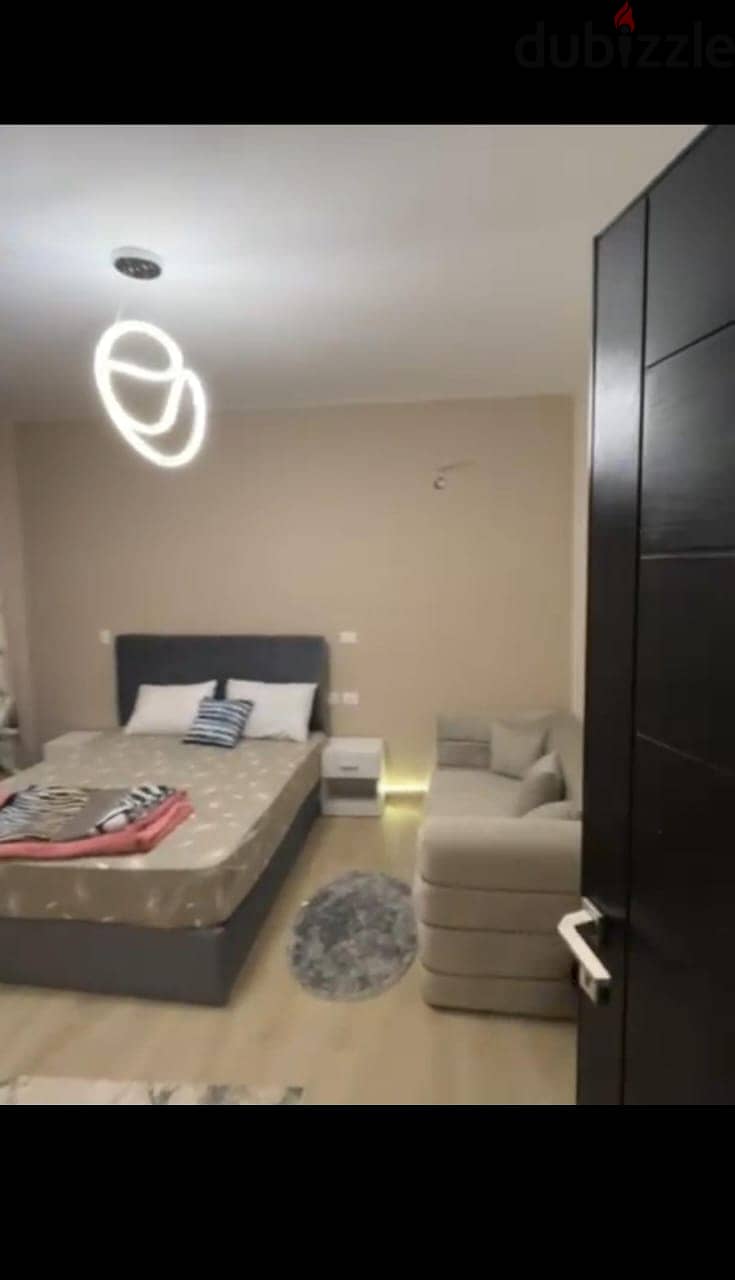 Apartment 165. M with garden 110. M in The Address East New Cairo fully finished with kitchen cabinets overlooking landscape and water features for sale 4