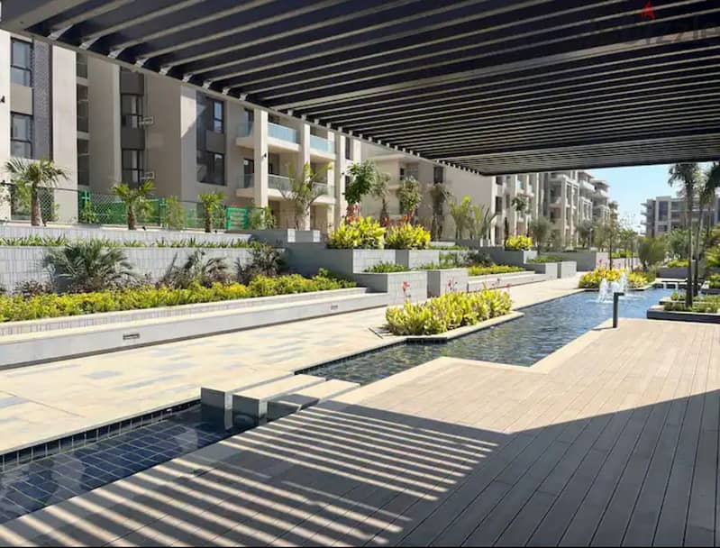 Apartment 165. M with garden 110. M in The Address East New Cairo fully finished with kitchen cabinets overlooking landscape and water features for sale 10