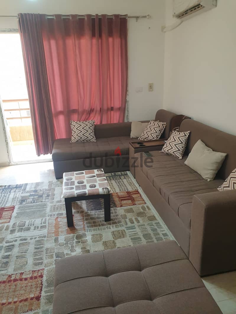 Furnished apartment for rent in Madinaty, 89 meters, in B6, a distinguished floor, with a wide garden view, next to services 2