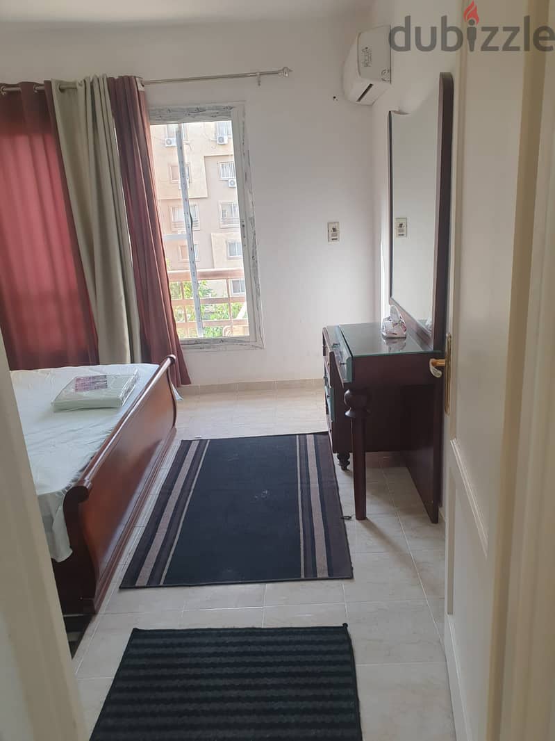 Furnished apartment for rent in Madinaty, 89 meters, in B6, a distinguished floor, with a wide garden view, next to services 7