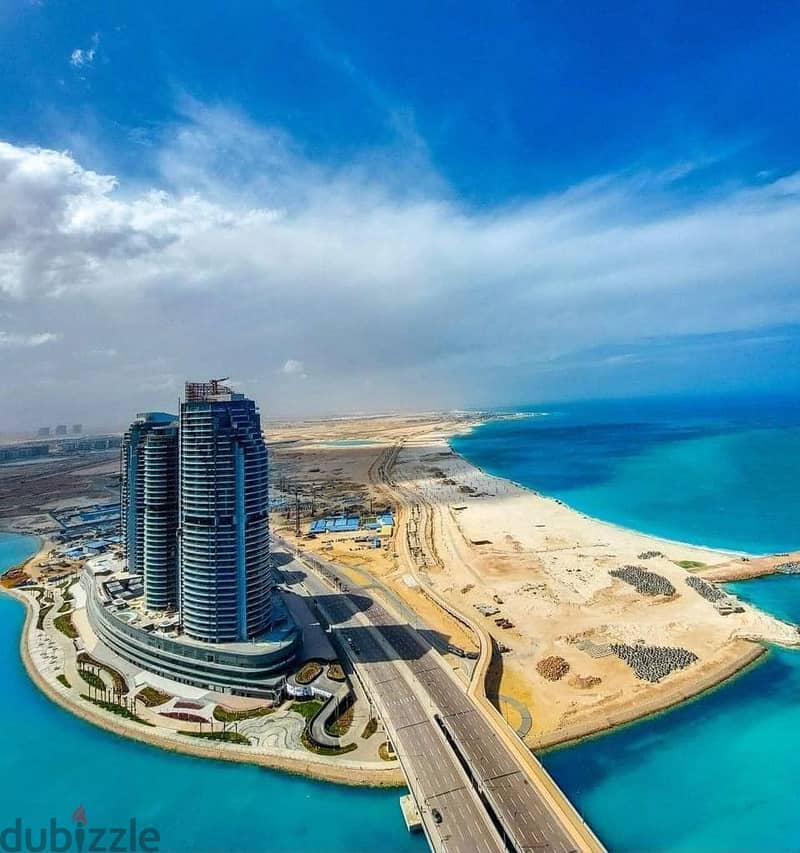 217 sqm hotel apartment with double sea and lagoon view for sale in City Edge Towers, Al Alamein 3