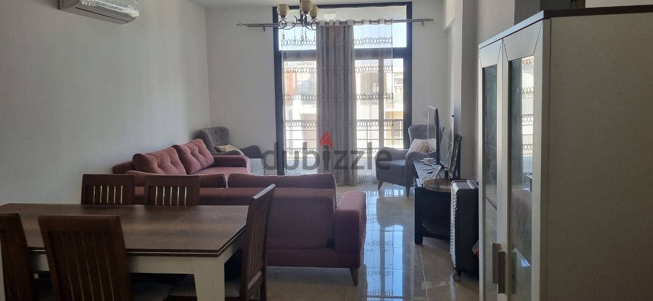 For sale, an apartment with ready to move finished, with air conditioners and kitchen, with a down payment and installments, in Fifth Square 9