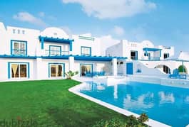 In installments, a villa ((Greek style)) 3 floors for sale (ground - first - roof) in Mountain View, North Coast