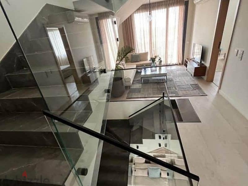 Penthouse for sale in installments, swimming pool, finished roof, and air conditioning, in a very special location in the Revali Compound. 5