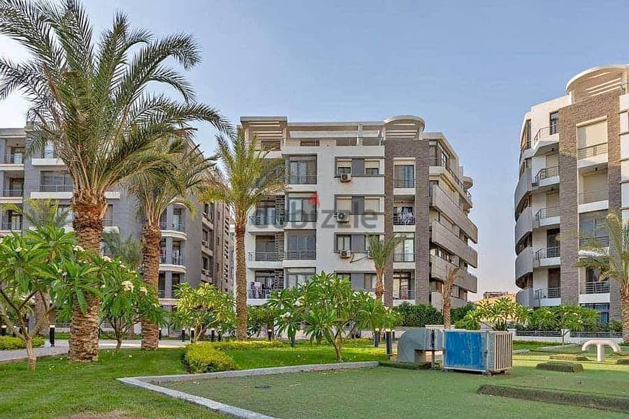 Apartment for sale, 166 sqm, prime location on Suez Road, directly in front of Cairo Airport, Compound Taj City New Cairo 7
