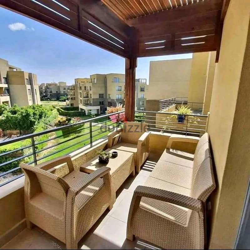 For sale, an apartment with a garden, 131 m, in the best location, near the American University AUC, in Palm Hills New Cairo Compound 0