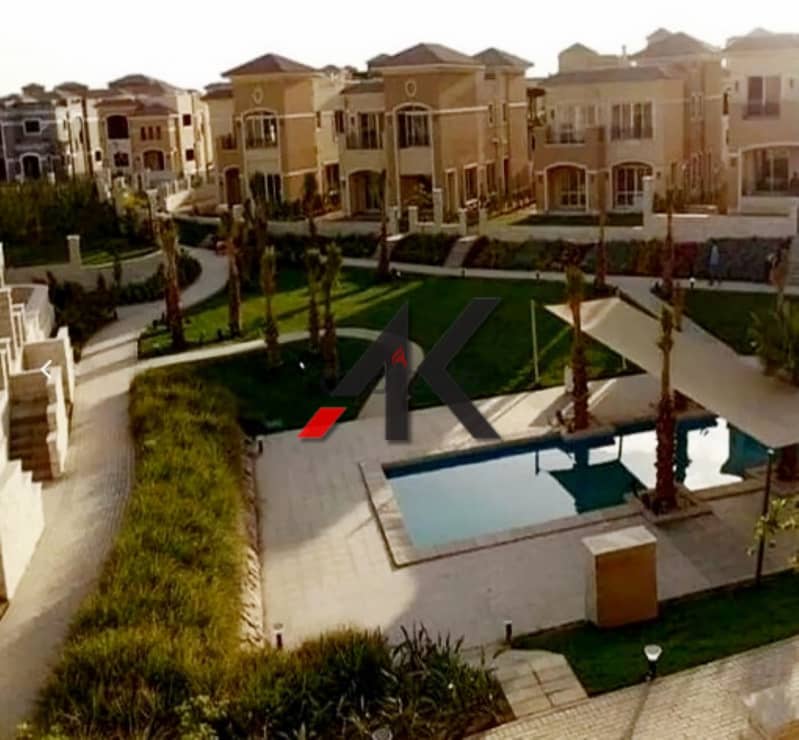 Direct overlooking lagoon - installment Town Middle For Sale in Telal East - New Cairo 1
