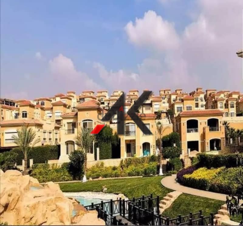 Direct overlooking lagoon - installment Town Middle For Sale in Telal East - New Cairo 2