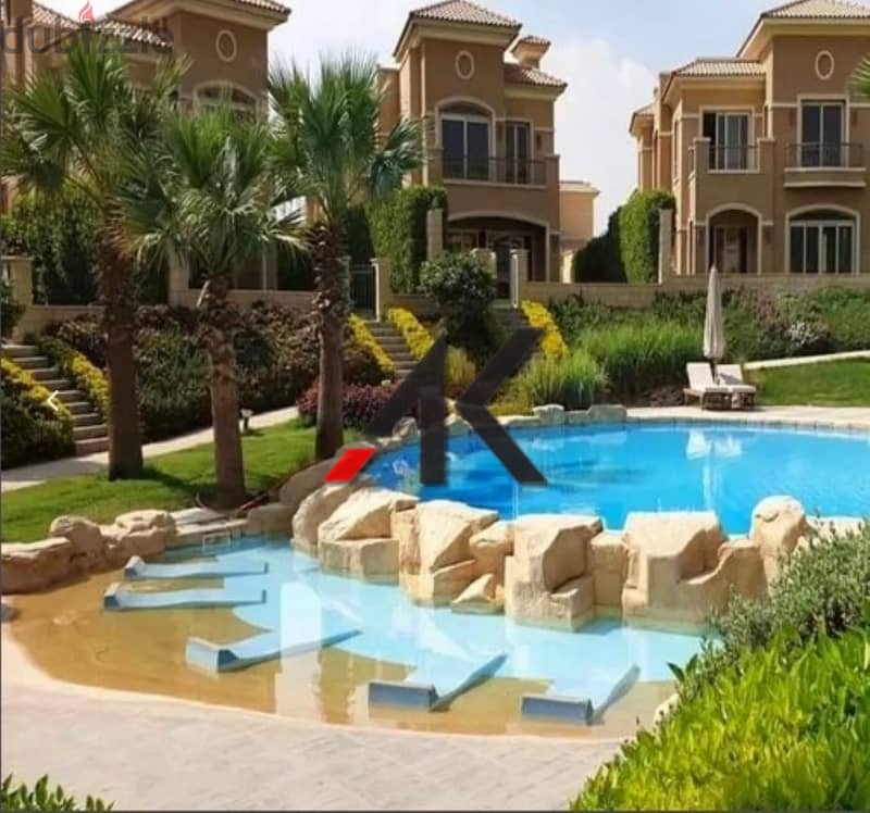 Direct overlooking lagoon - installment Town Middle For Sale in Telal East - New Cairo 5