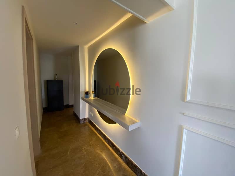 Furnished ground floor apartment with garden for rent in Mivida Compound in a privileged location overlooking Central Park - شقة ارضي بجاردن مفروشة 2