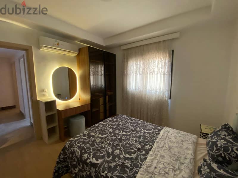 Furnished ground floor apartment with garden for rent in Mivida Compound in a privileged location overlooking Central Park - شقة ارضي بجاردن مفروشة 11