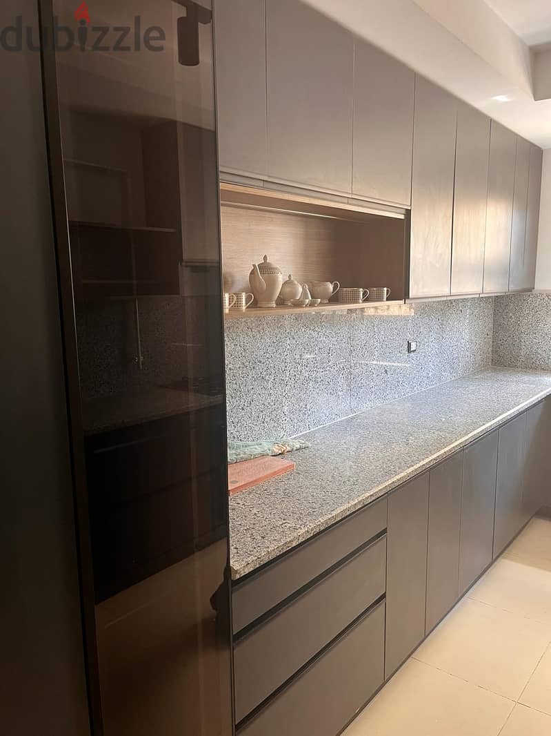 Furnished ground floor apartment with garden for rent in Mivida Compound in a privileged location overlooking Central Park - شقة ارضي بجاردن مفروشة 21