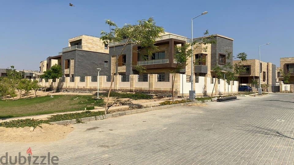 townhouse villa for sale with a 42% discount in Taj City Compound, a very special location on the Suez Road, 8-years installments 8