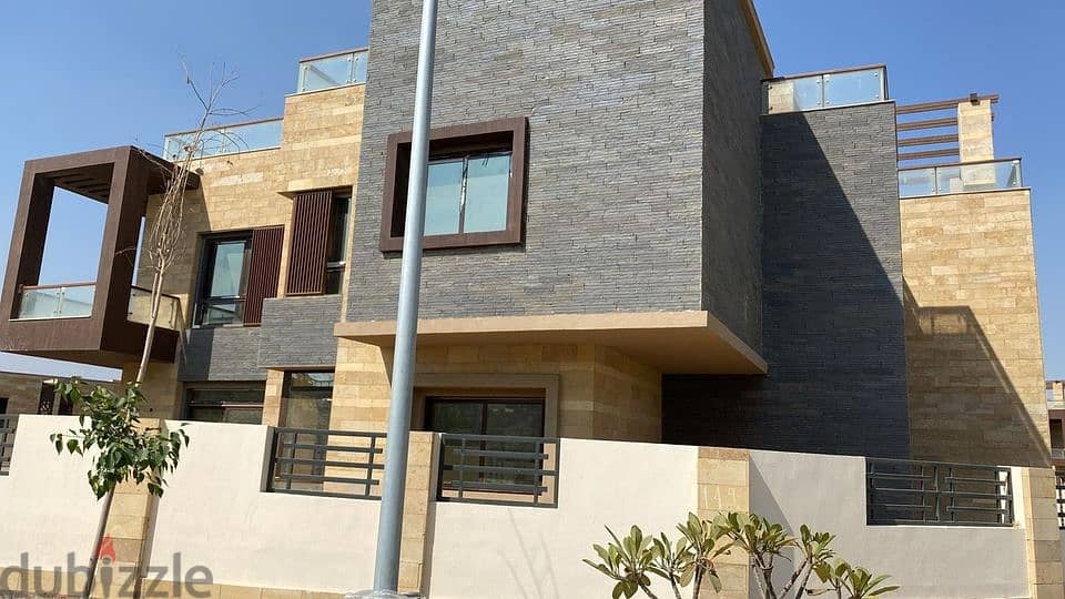 townhouse villa for sale with a 42% discount in Taj City Compound, a very special location on the Suez Road, 8-years installments 11