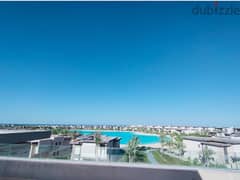 Penthouse Directly on 11 Feddan Lagoon in Swan lake North Coast For Sale 0