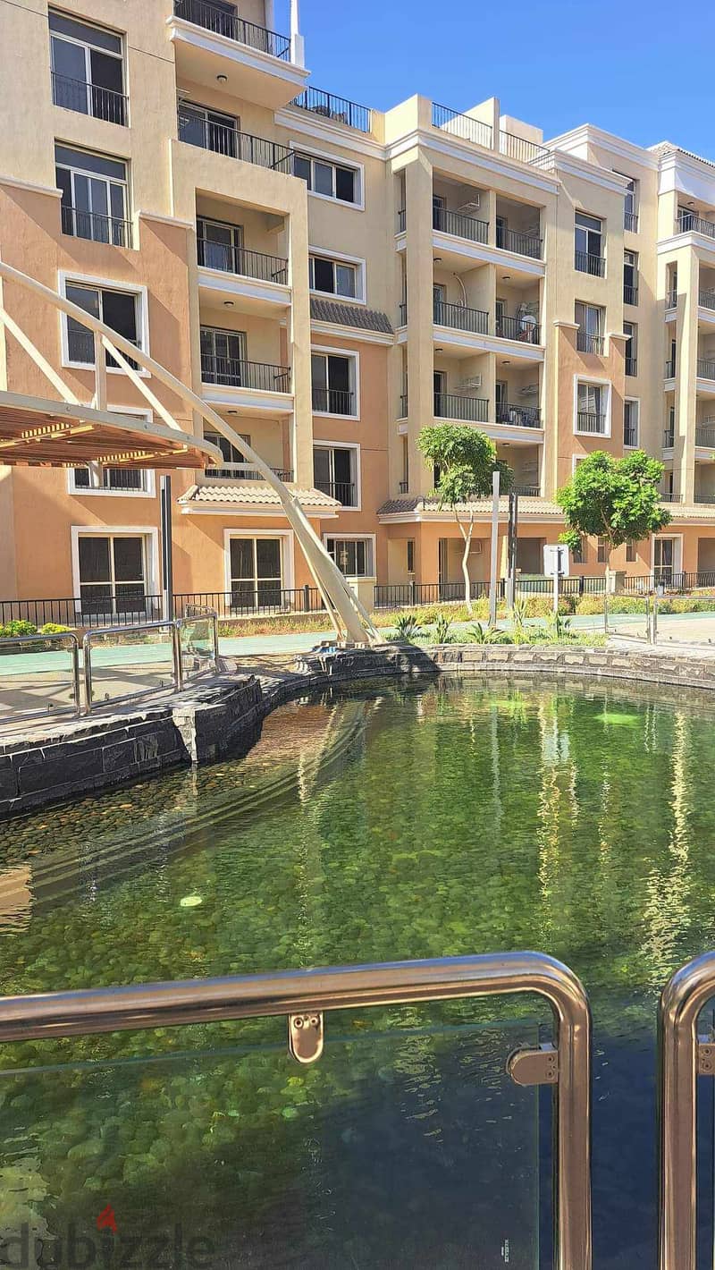 Next to Al Shorouk, an apartment with a garden for sale in Sarai Compound 7