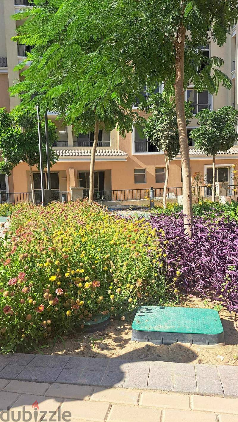 Next to Al Shorouk, an apartment with a garden for sale in Sarai Compound 8