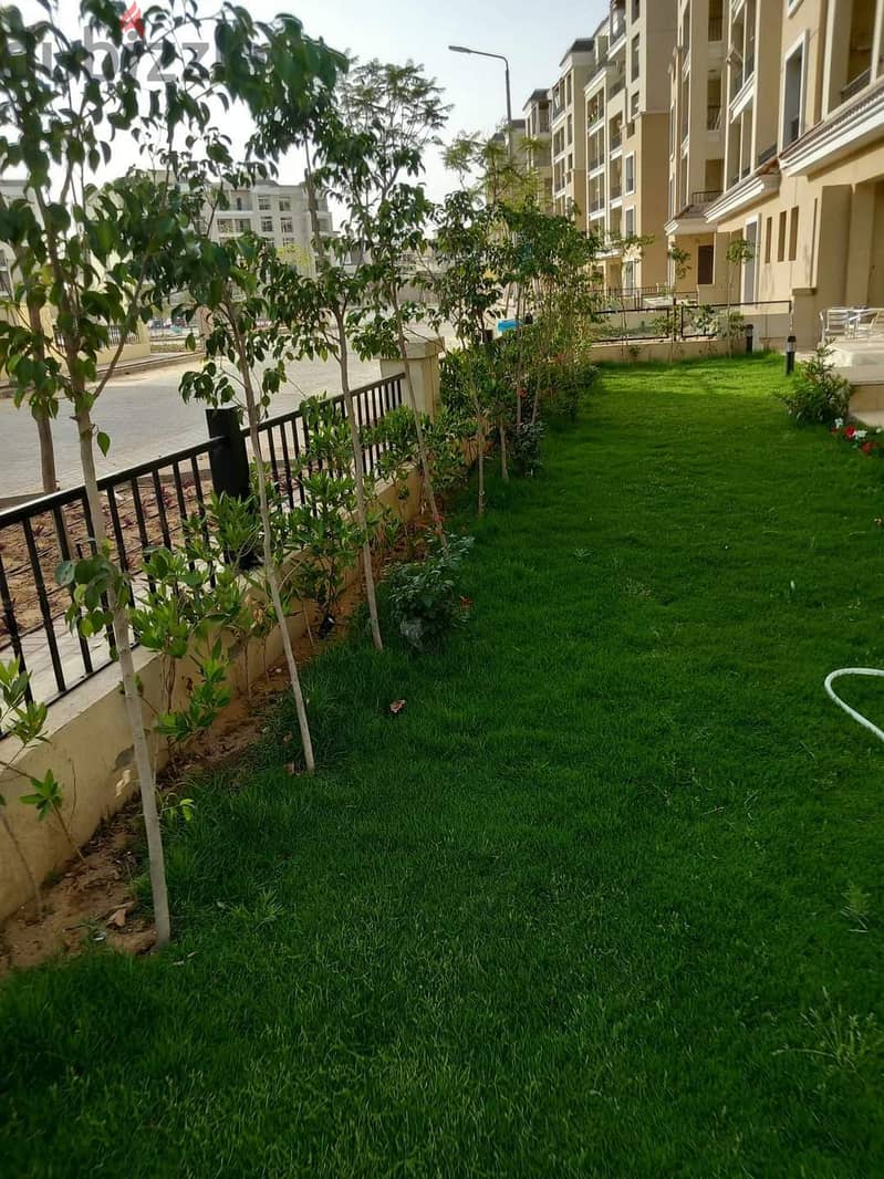 Next to Al Shorouk, an apartment with a garden for sale in Sarai Compound 11