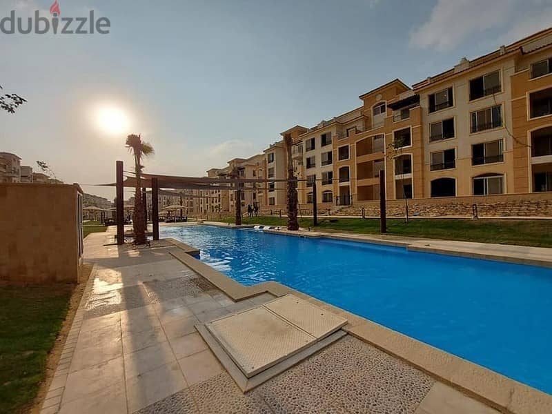 For a snapshot price, I own an apartment with a garden in the best location in the settlement on the Maadi Ring Road Stone Park 7