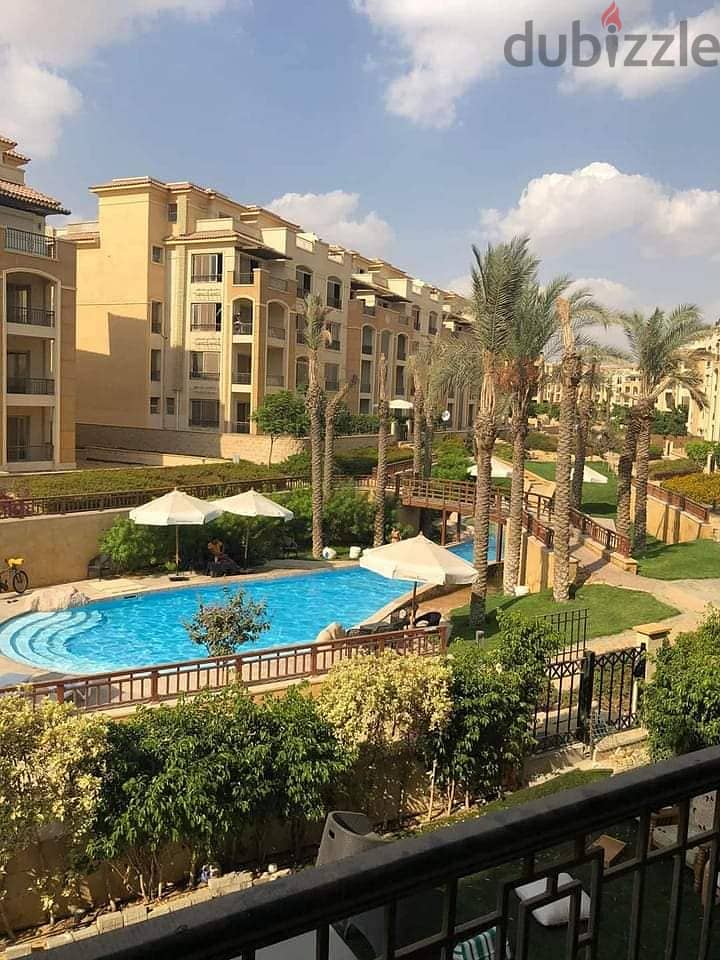 For sale, 220 sqm apartment, immediate receipt and installments, in Stone Residence Compound in New Cairo 1