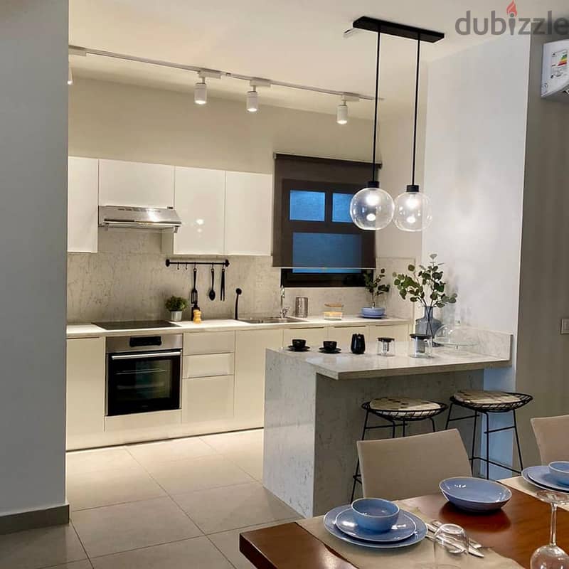 Duplex with garden for sale, immediate receipt and finished, in Al-Shorouk, directly in front of the International Medical Center | Al Burouj Compound 4