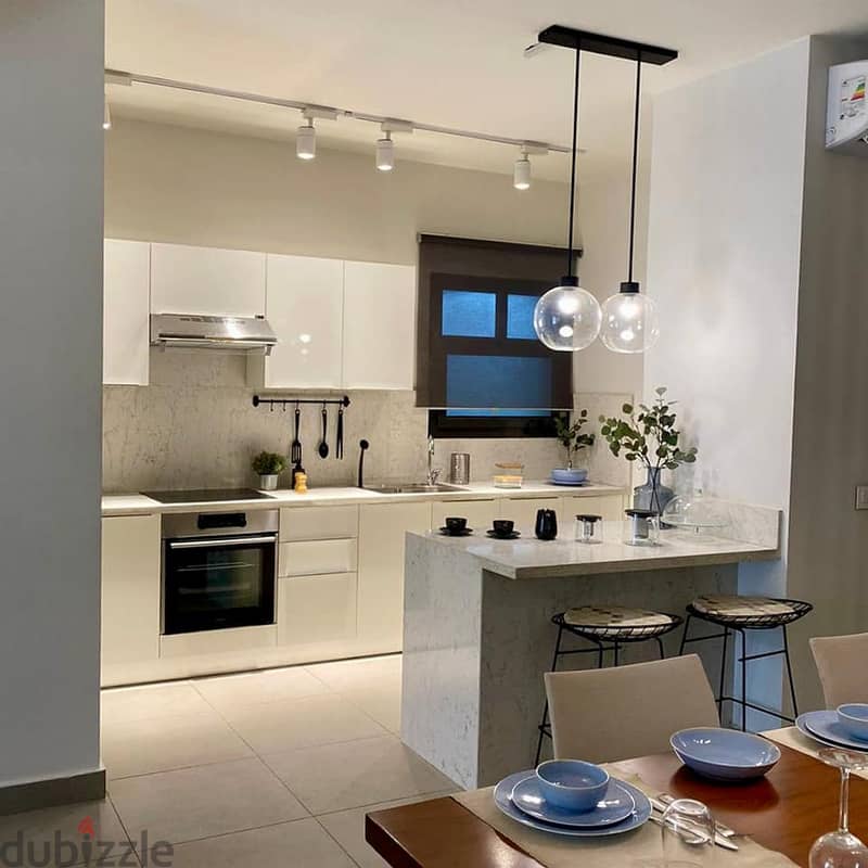 Duplex with garden for sale, immediate receipt and fully finished, directly in front of the International Medical Center| al brouj 1