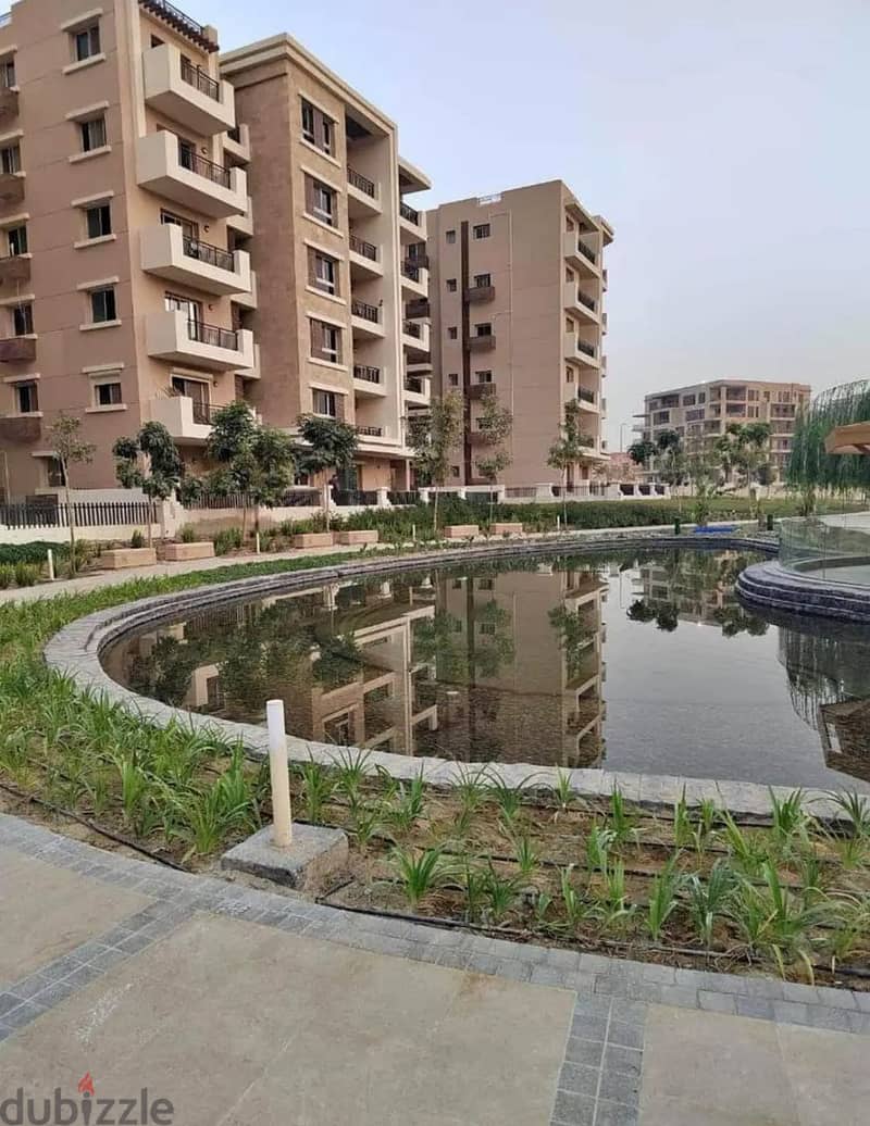 Ground floor apartment with garden, 70m in front of the international airport in Taj City Compound, Fifth Settlement 4