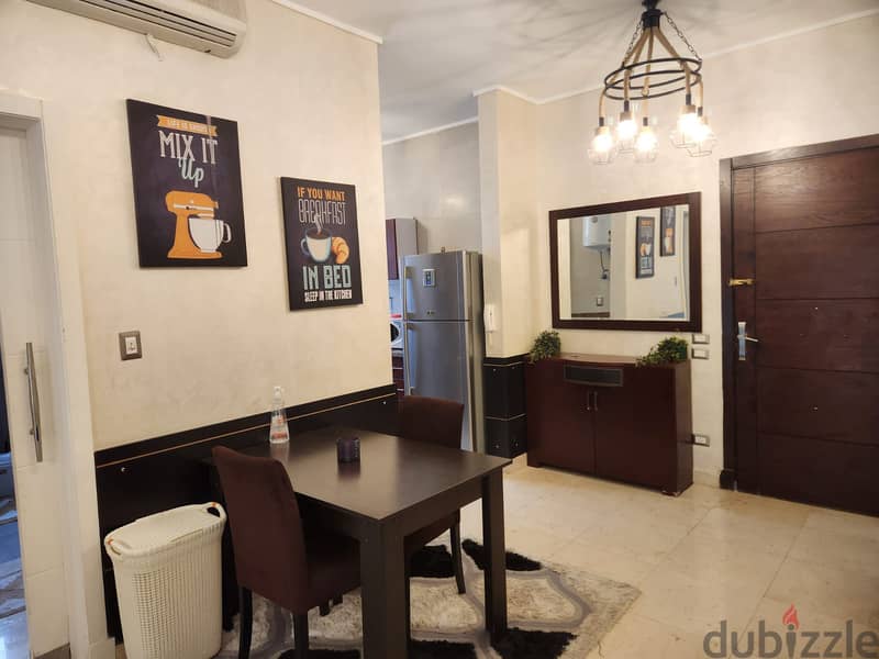 studio 90m with garden fully furnished for rent in village gate New Cairo 10