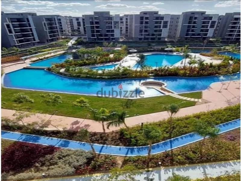 Ground apartment with a private garden, immediate receipt, in Sun Capital, the heart of October, with a 10% down payment and equal installments 1