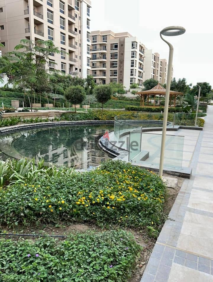 Luxurious Apartment for sale, 137 sqm + Private Garden with a very distinctive landscape view in front of Cairo International Airport, available on in 5