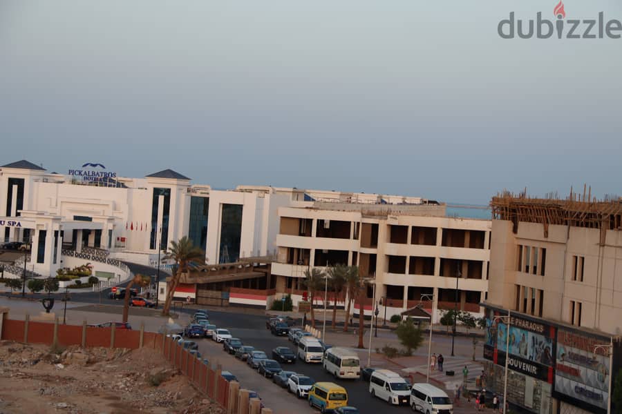 Own your apartment in a quiet location in Hurghada, overlooking the Tourist walk , with high investment 13