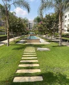 For sale, a two-bedroom apartment in a garden, 139 sqm, next to the American University in the Gallaria, Fifth Settlement