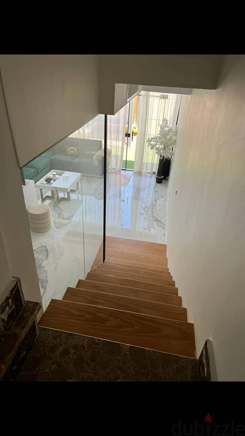 Villa for sale, close receipt, 225 meters, 3 floors, at the lowest price on the market in Taj City Compound, with a down payment and installments over 0