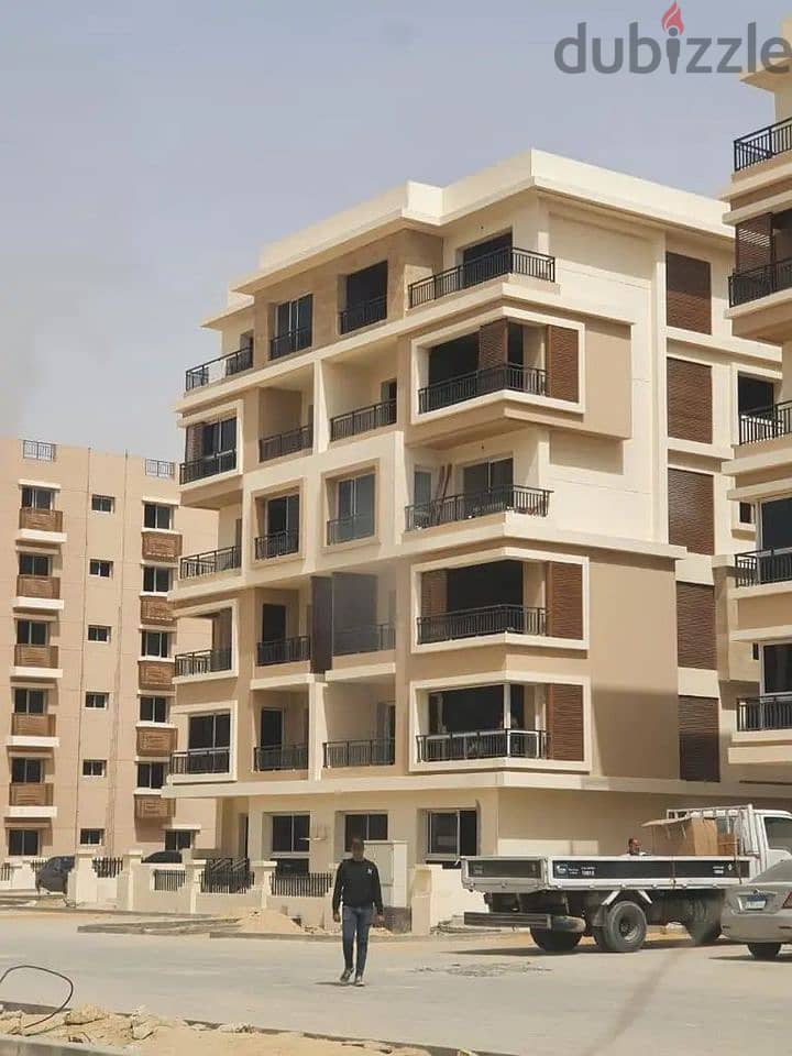 For sale, two-room apartment, 110 square meters, 8 years installments, in Sarai Compound, in front of Madinaty 7