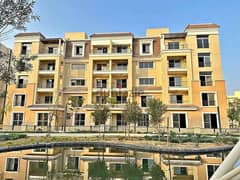 An apartment with a private garden for sale in Sarai Compound at a special price, minutes away from the Fifth Settlement, and there is also a 42% disc