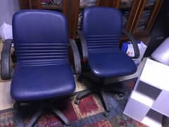 two swivel leather office chairs
