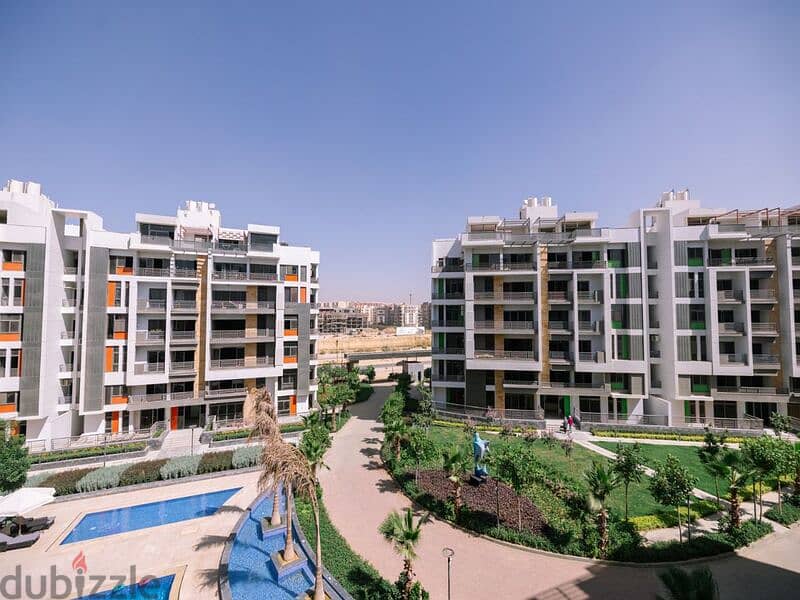 Apartment with garden for sale in Fifth Settlement, Golden Square, in icon Compound, with only 15% down payment 30% cash DIS |  view of the landscape 20