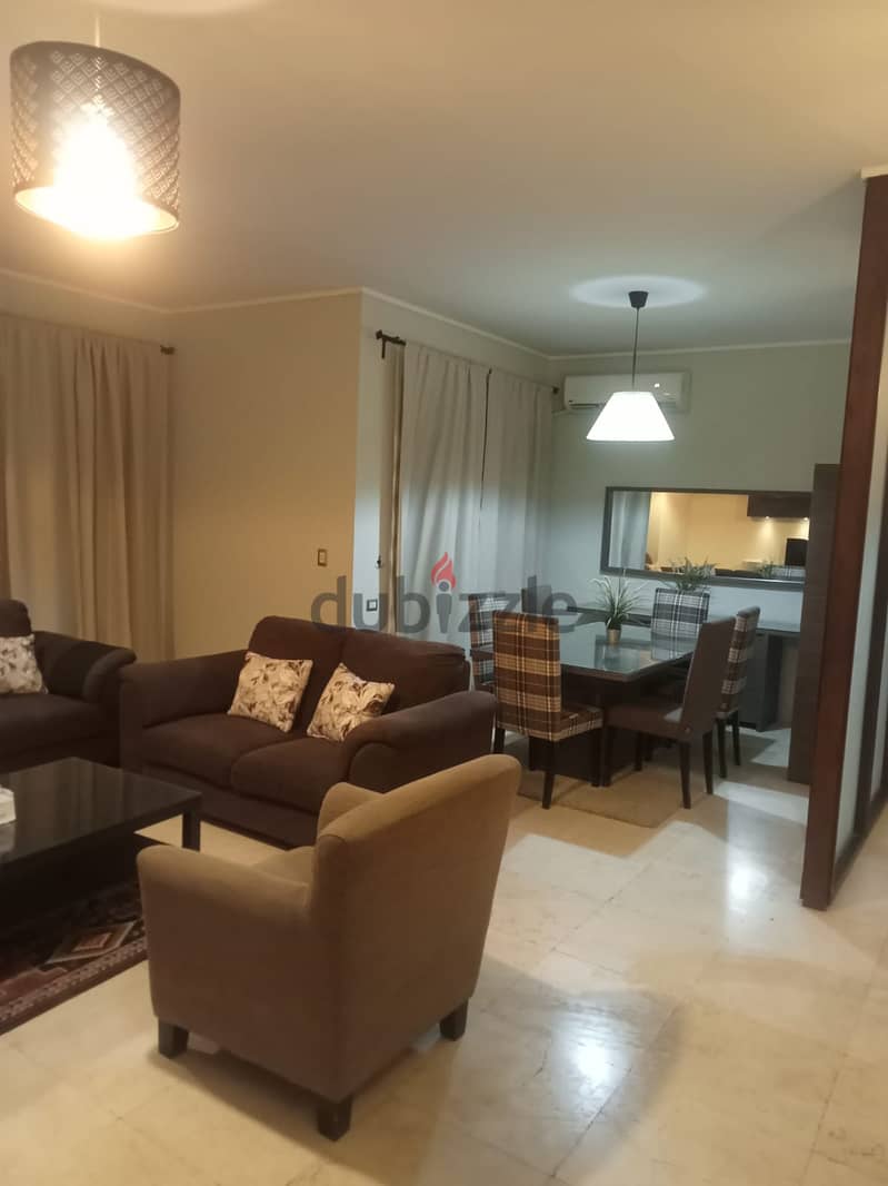lowest price Furnished Apartment with garden for rent in Village Gate new cairo 2