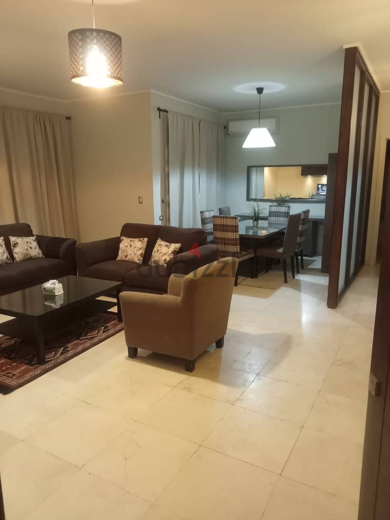 lowest price Furnished Apartment with garden for rent in Village Gate new cairo 6