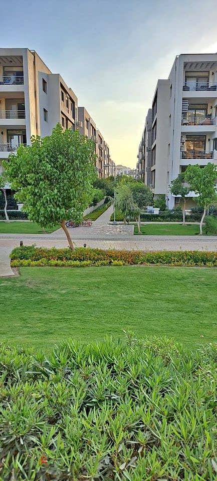 Luxurious Apartment for sale, 136 sqm + Private Garden with a very distinctive landscape view in front of Cairo International Airport, available on in 1