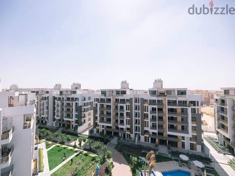 Apartment for sale in Fifth Settlement, Golden Square Icon Compound with only 15% down payment A distinctive view of the landscape - Cash dis 30% 4